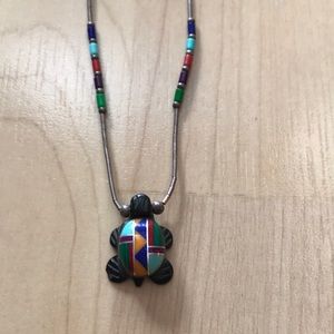 A beautiful turtle pendant ( with a chain).